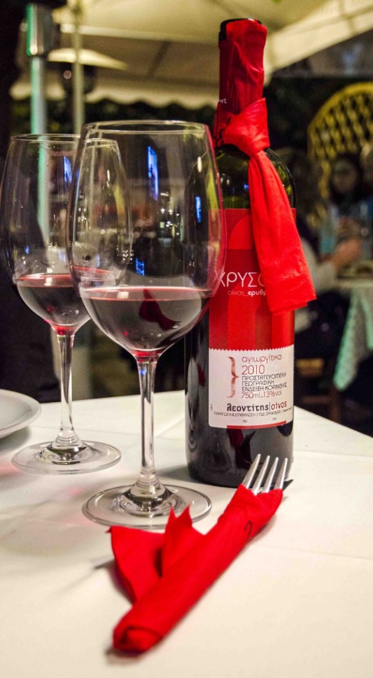 Our own Agiorgitiko wine Red wine bottle and two wine glasses